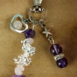 Sleutelhanger gouden driehoek met bedels nr. 2-4